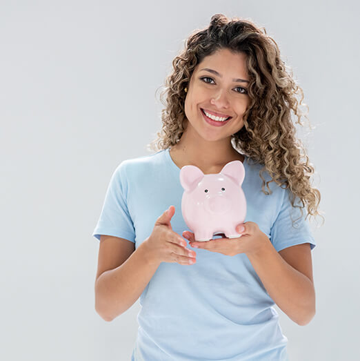 woman holding a piggy bank