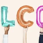 Diverse hands hold up multicolored letter balloons that say WELCOME