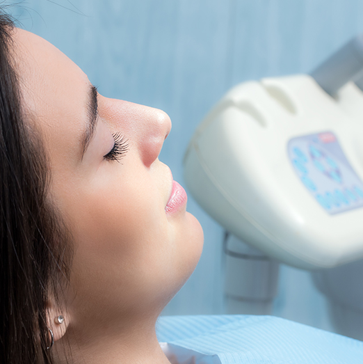 woman at the dentist with eyes closed